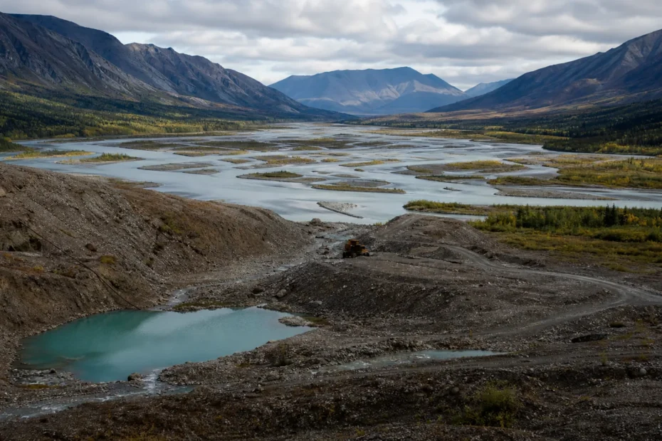 Yukon river valley with historic placer mining landscape and modern mine access road